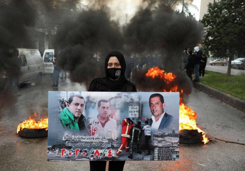 Beirut blast victims' families protest after lead investigator removed from role Beirut blast victims' families protest after lead investigator removed from role