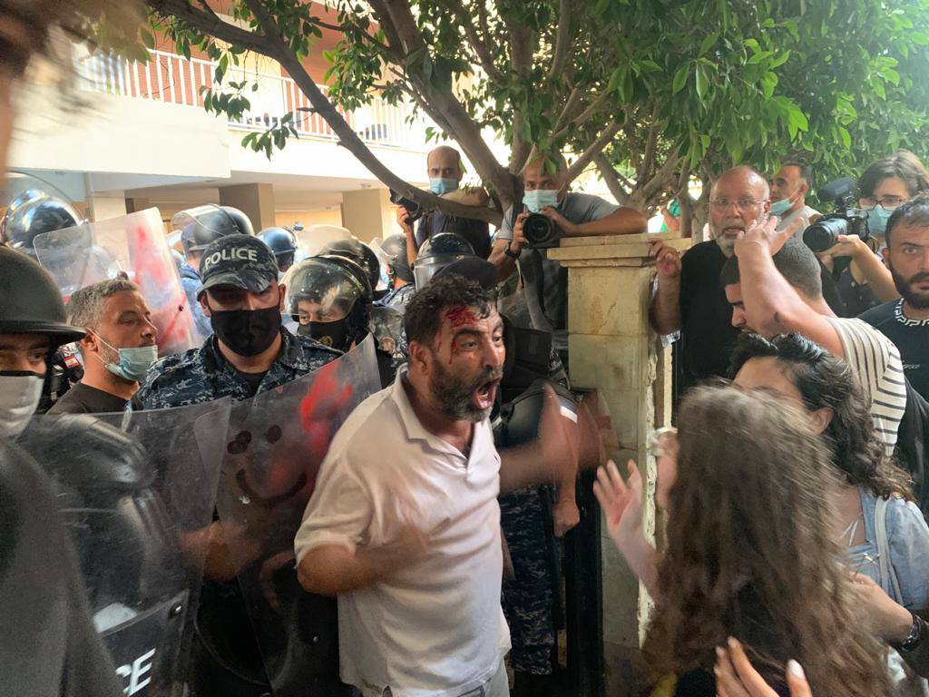 Security forces beat, tear gas protesters angered by minister’s decision to protect a top official from prosecution