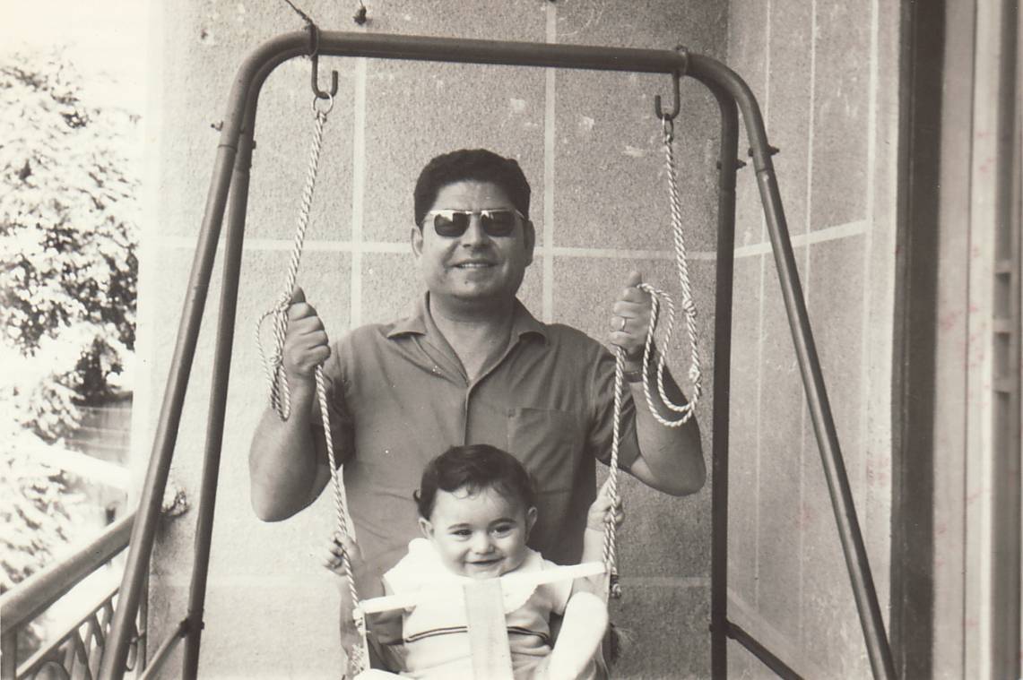 Ardem Patapoutian on a swing as a child with his father in West Beirut. (Photo courtesy of Ardem Patapoutian)