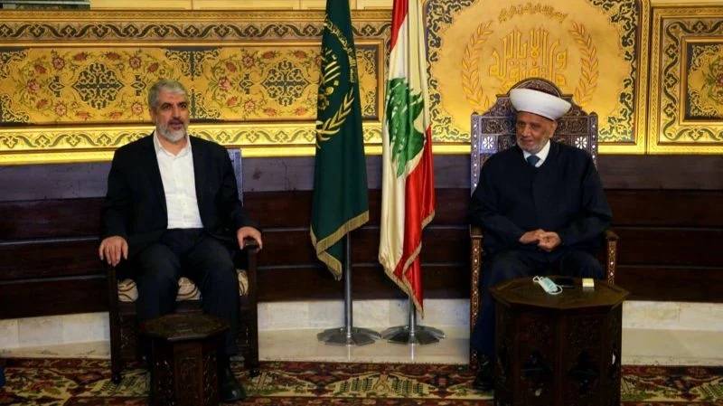 Hamas' Khaled Mechaal meets Grand Mufti Derian, assures him of his group's 'respect for this country, its political authority and its laws'