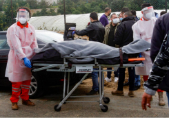 The body of Lokman Slim is evacuated on Feb. 4, 2021, shortly after his assassination in South Lebanon. (Credit: Mahmoud Zayyat /AFP archives)