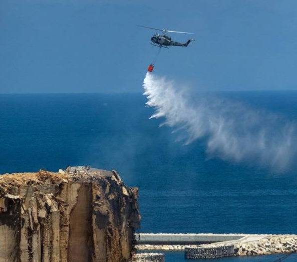 Army choppers seen dowsing blaze at Beirut port’s grain silos