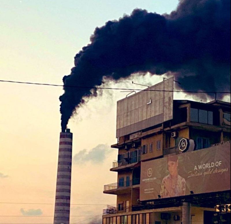 Thick black smoke rises from the Zouk power plant