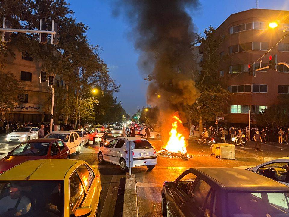 Eight killed as protests spread over Iranian woman's death