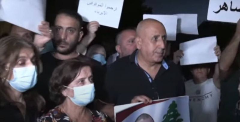 Relatives of port blast detainees demonstrate in front of the Higher Judicial Council's head's house