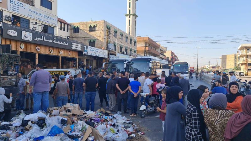 Families of migrants detained in Greece and Turkey block roads in Akkar