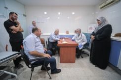 Bebnine Municipality member Nouhad Salma (in front), Akkar governor Imad Labki and Bebnine mayor Kifah Kassar at the clinic in Bebnine. (Credit: João Sousa/L'Orient Today)