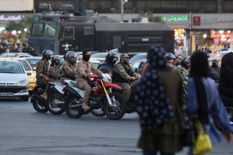 After dark, Iran security forces take aim at protest buildings