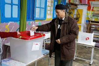 Tunisians elect weakened parliament on 11 percent turnout