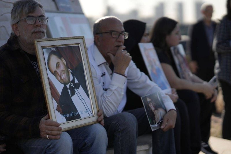 Families of the Beirut blast victims hold monthly vigil near port