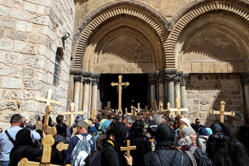 Orthodox Christians await Holy Light in Jerusalem under heavy police restrictions