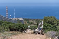The T-wall and technical fence alongside UNIFIL blue barrels. (Photo sent to L'Orient Today by UNIFIL)