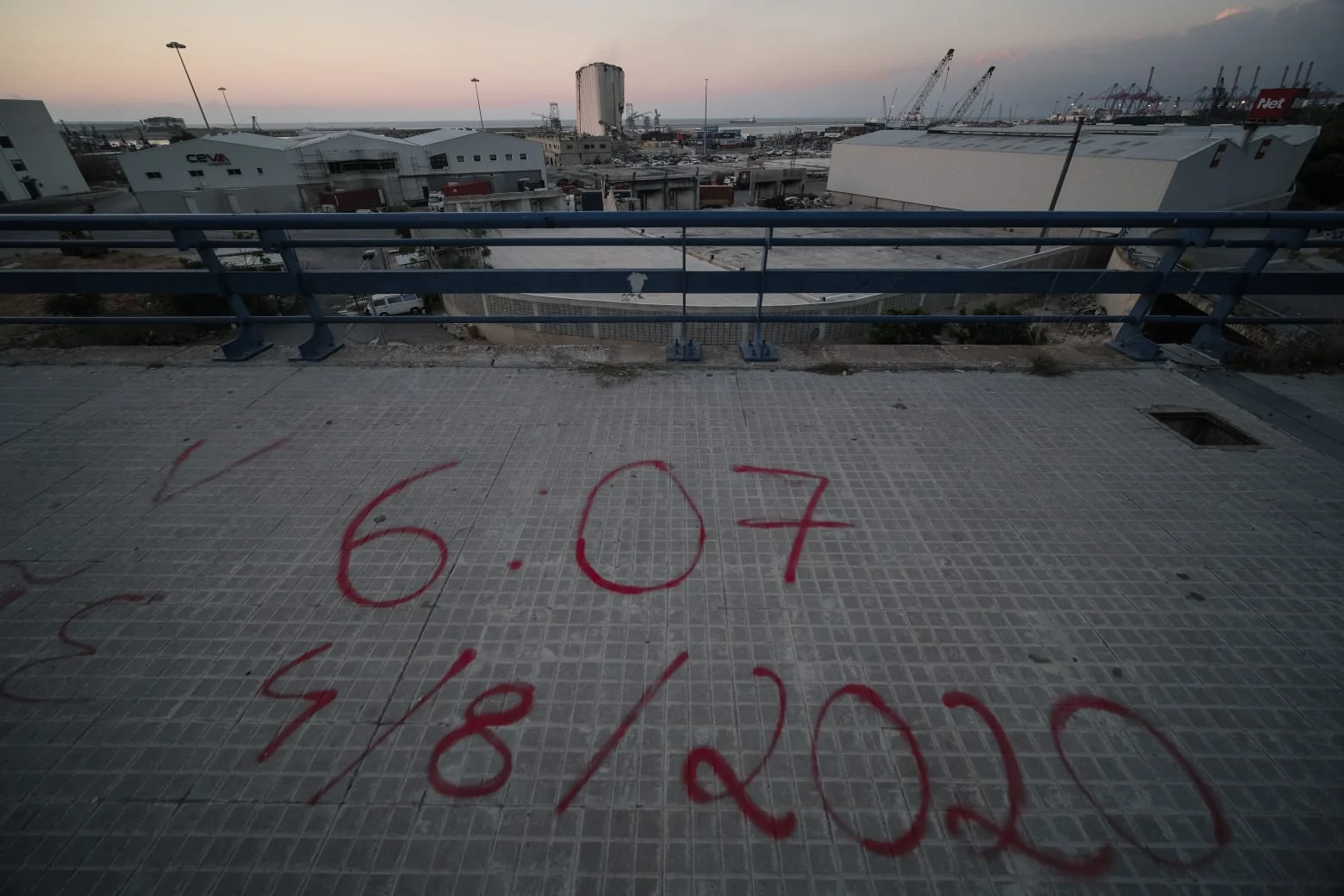 A view of the Beirut port . On the sidewalk, the date and time of the Aug,4, 2020 are written in red. (Credit Photo: Joao Sousa/ L'Orient Today)