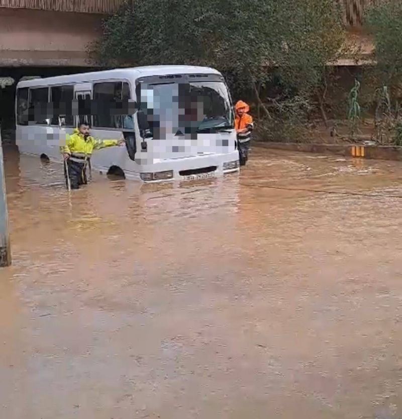 23 students rescued after school bus trapped by heavy rain