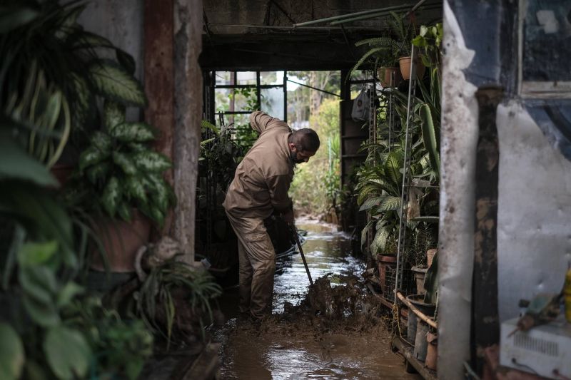Karantina businesses dig themselves from the mud a week after devastating flood