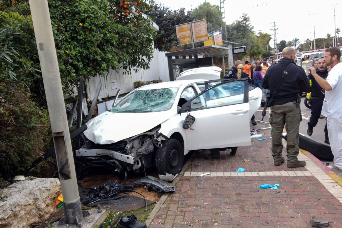 Motorist stabs, rams 19 in central Israel, motive unclear