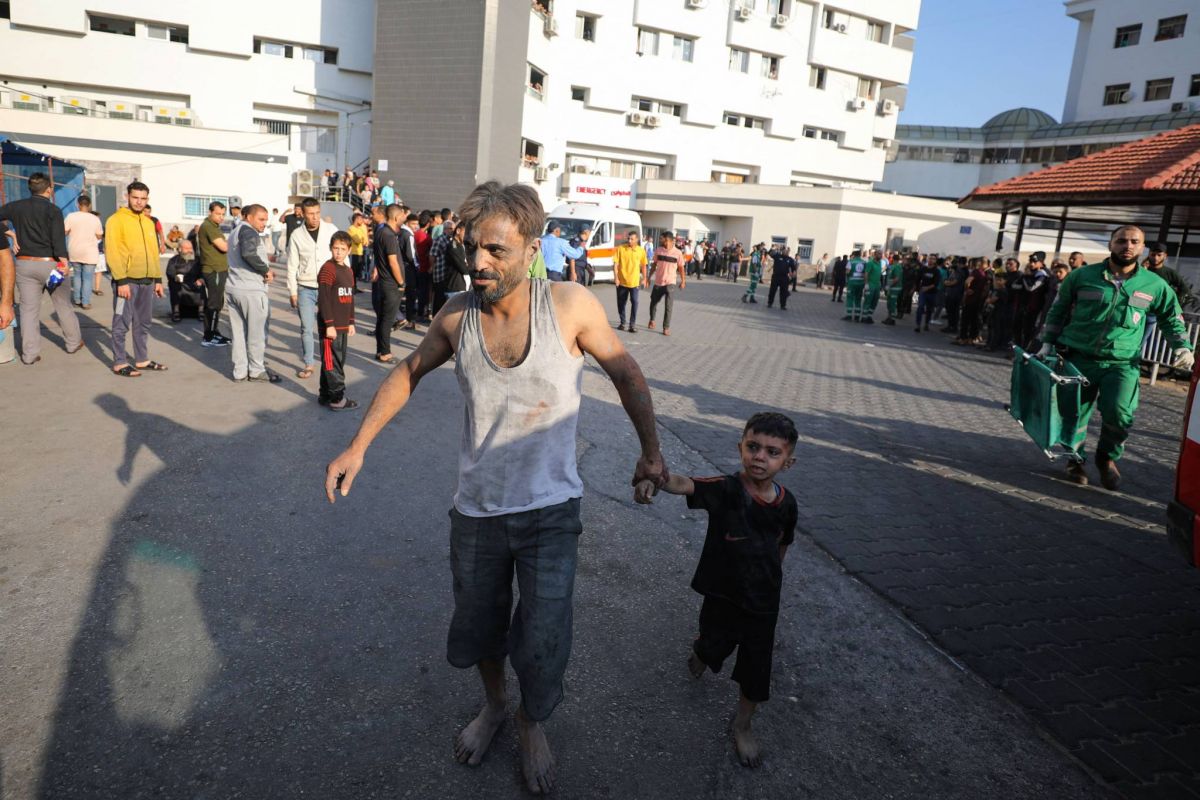 Hospital official says 50 killed as Israel fires on Gazans rushing to aid trucks