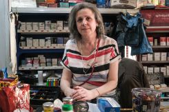 Owner of a convenience shop in Achrafieh, Beirut, Hanan Fayyad poses for a picture, April 24, 2024. (Credit: João Sousa/L'Orient Today)