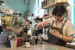 A barista at Kalei crafts a cappuccino. Beirut, 2024. (Credit: Joao Sousa, L'Orient Today)