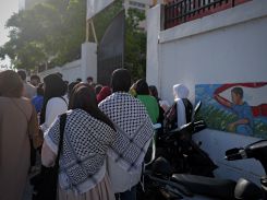 High school students wearing kuffiyehs as they arrive at Bazouriyeh public high school for the Bac exams, July 2, 2024. (Credit: Matthieu Karam)