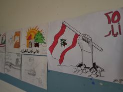 Pupils' drawings displayed in a corridor of the public secondary school in Bazouriyeh, south Lebanon, on July 2, 2024. (Credit: Matthieu Karam)