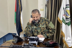 Hamas leader Saleh al-Arouri conducting a telephone interview in his Beirut office. Photo published by the Islamist movement on Jan. 3, 2024, the day after al-Arouri was killed in an Israeli strike in the southern suburbs of Beirut. (Credit: AFP)