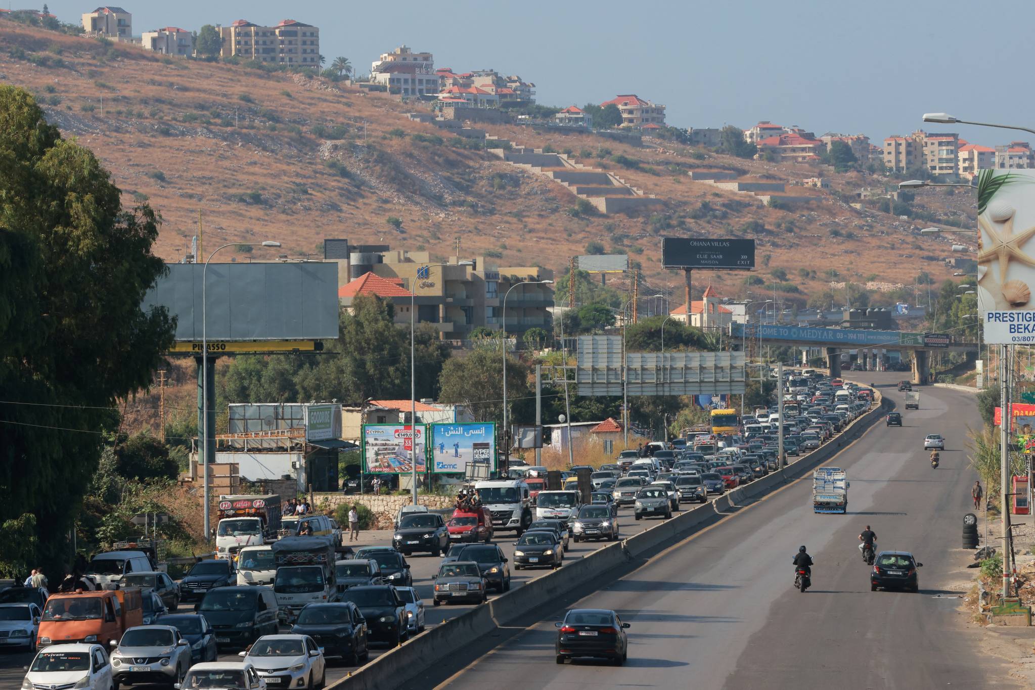 The exodus continued on the morning of Tuesday, Sept. 24. On the Damour highway, there were massive traffic jams as residents fled southern Lebanon. (Credit: Ibrahim Amro/AFP)