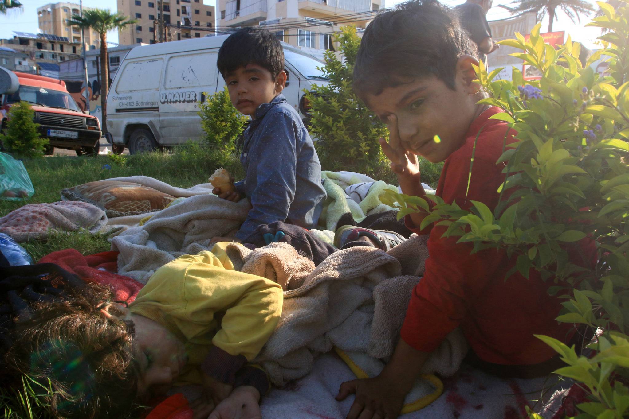 These families include children, of course. (Credit: Mahmoud Zayyat/AFP)
