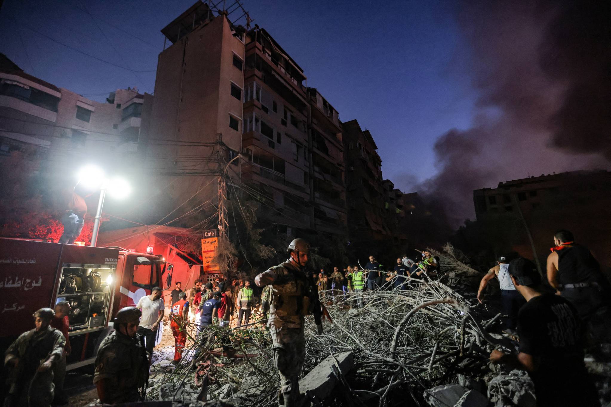 Soldiers walking through the rubble of the buildings hit by the Israeli strike. on Sept. 27, 2024. (Credit: Ibrahim Amro/AFP)