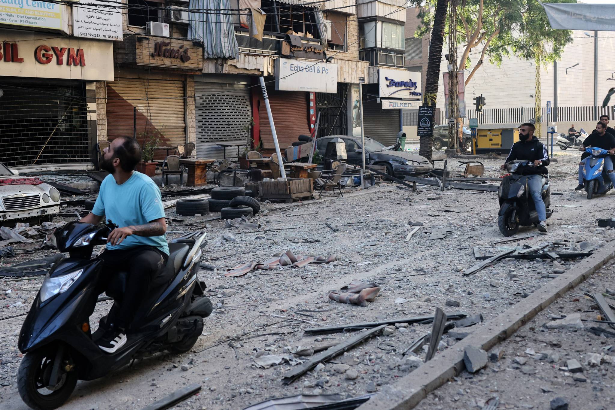 At dawn, residents discover the damage in Beirut’s southern suburbs. Photo credit: Anwar Amro/AFP
