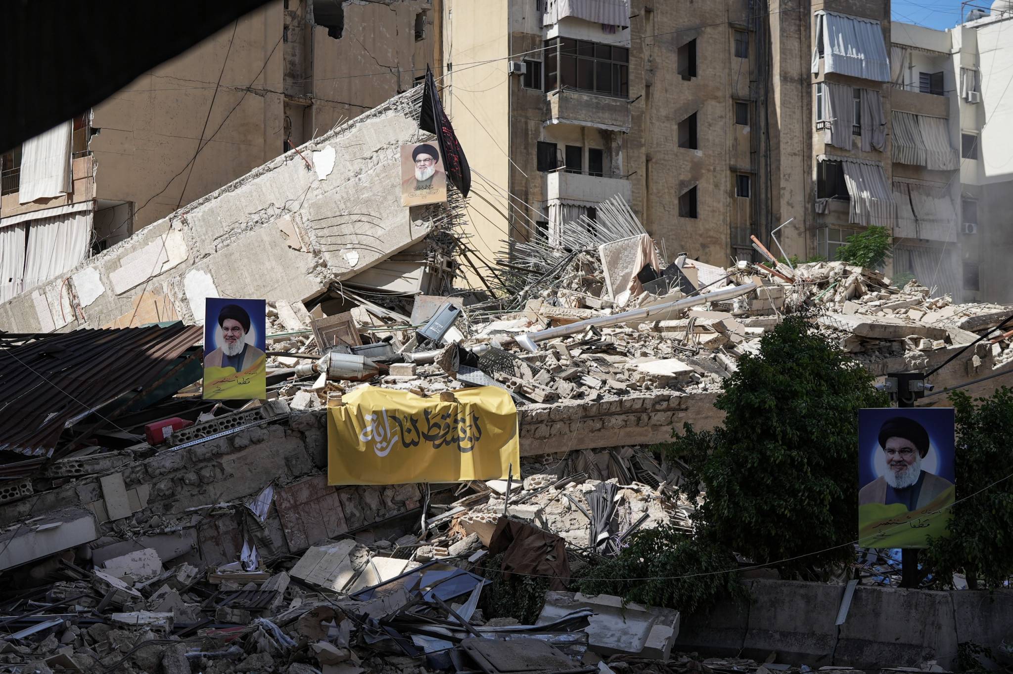 On these ruins, some have hung portraits of Hezbollah leader Hassan Nasrallah, who was killed in a strike on the party's headquarters in the southern suburbs on Sept. 27, 2024. (Credit: Mohammad Yassine/OLJ)