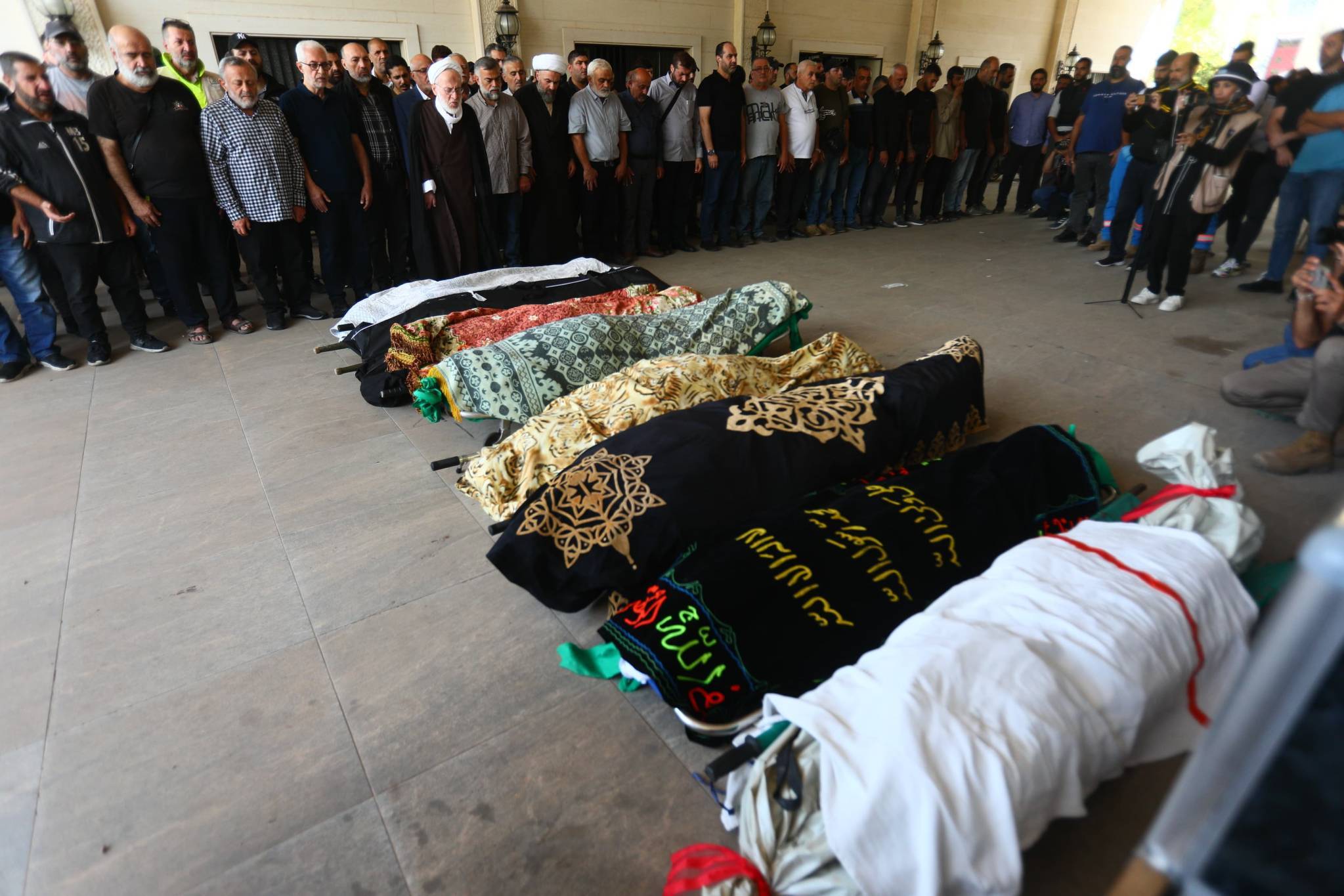 The Civil Defense also announced the death of one of its members, Nagi Fahd, who was "with his colleagues fulfilling his national and humanitarian duty" in the targeted building. At least 52 others were also injured. The funerals took place on the 18th of October. (Credit: Mohammad Yassine/OLJ)