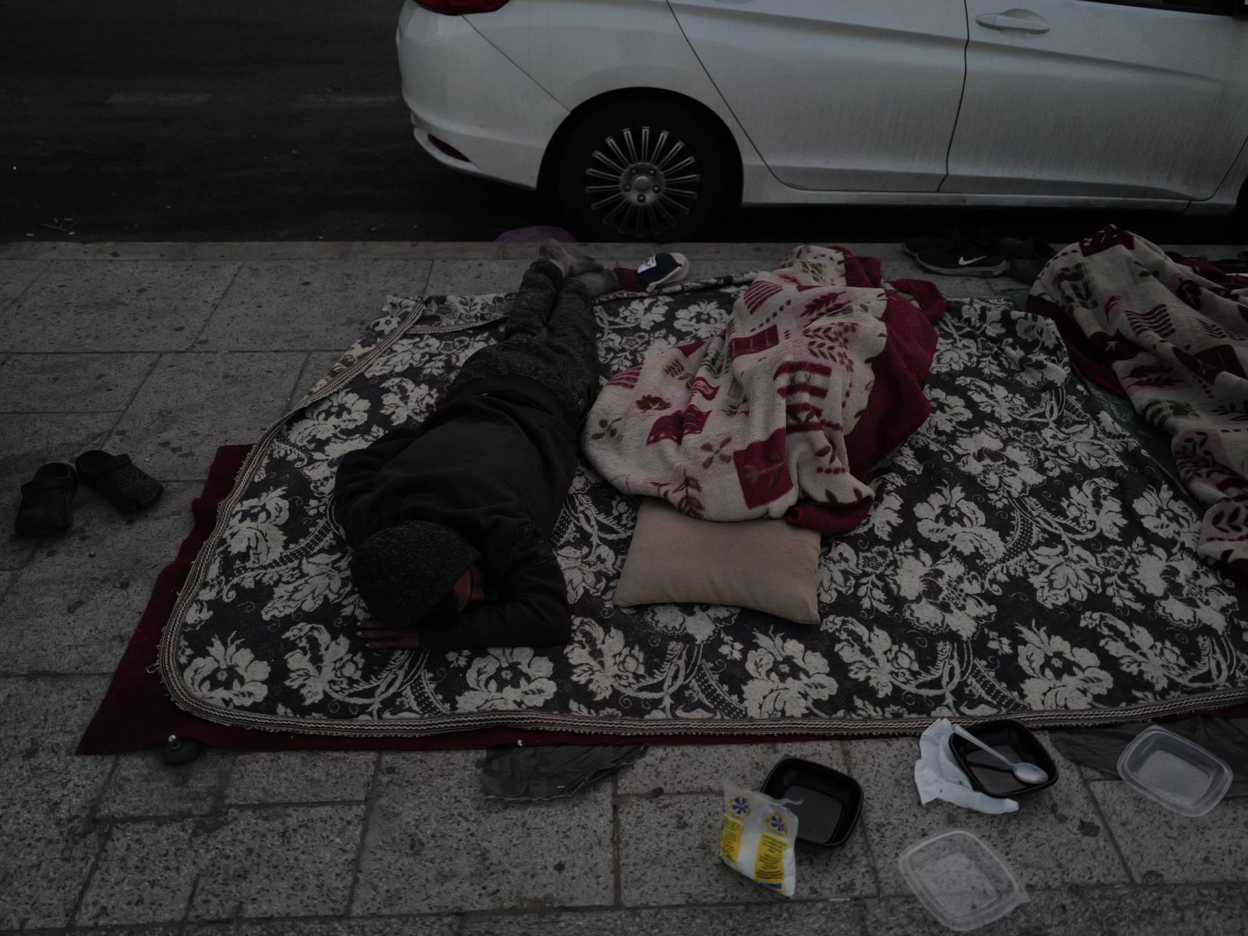 But not everyone is so “lucky.” Some sleep on the sidewalk, with nothing over their heads. (Credit: Matthieu Karam)