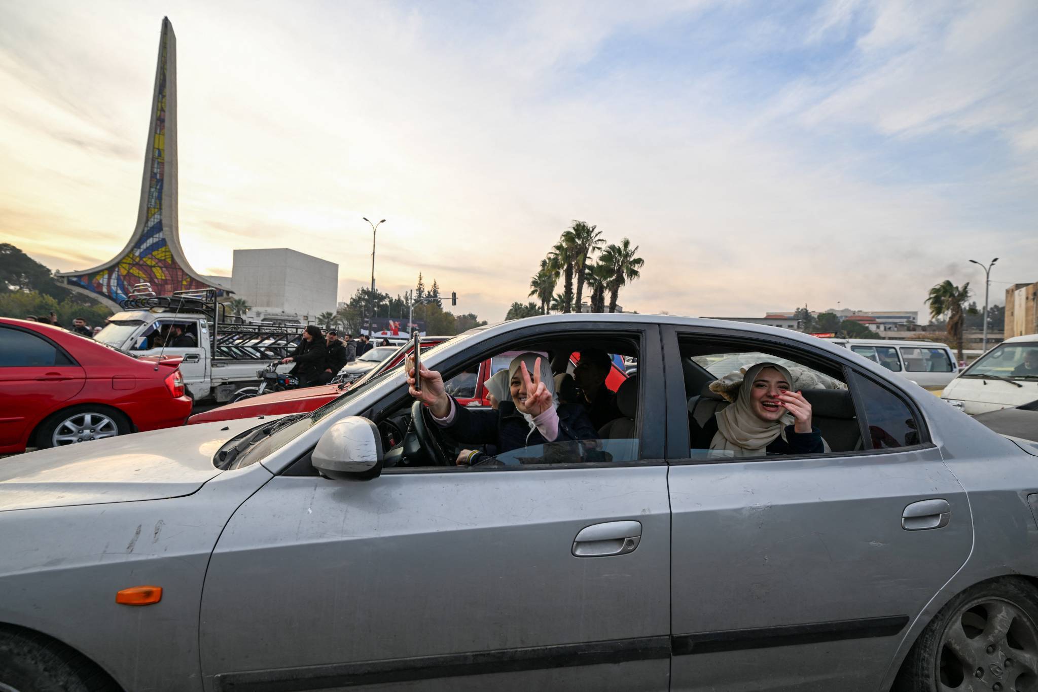 According to witnesses contacted by AFP, a few dozen people rallied in Umayyad Square, in the center of the capital, to celebrate the fall of the Assad clan in power for more than half a century, in a country torn apart by a deadly civil war since 2011. (Credit: Louai Beshara/AFP)