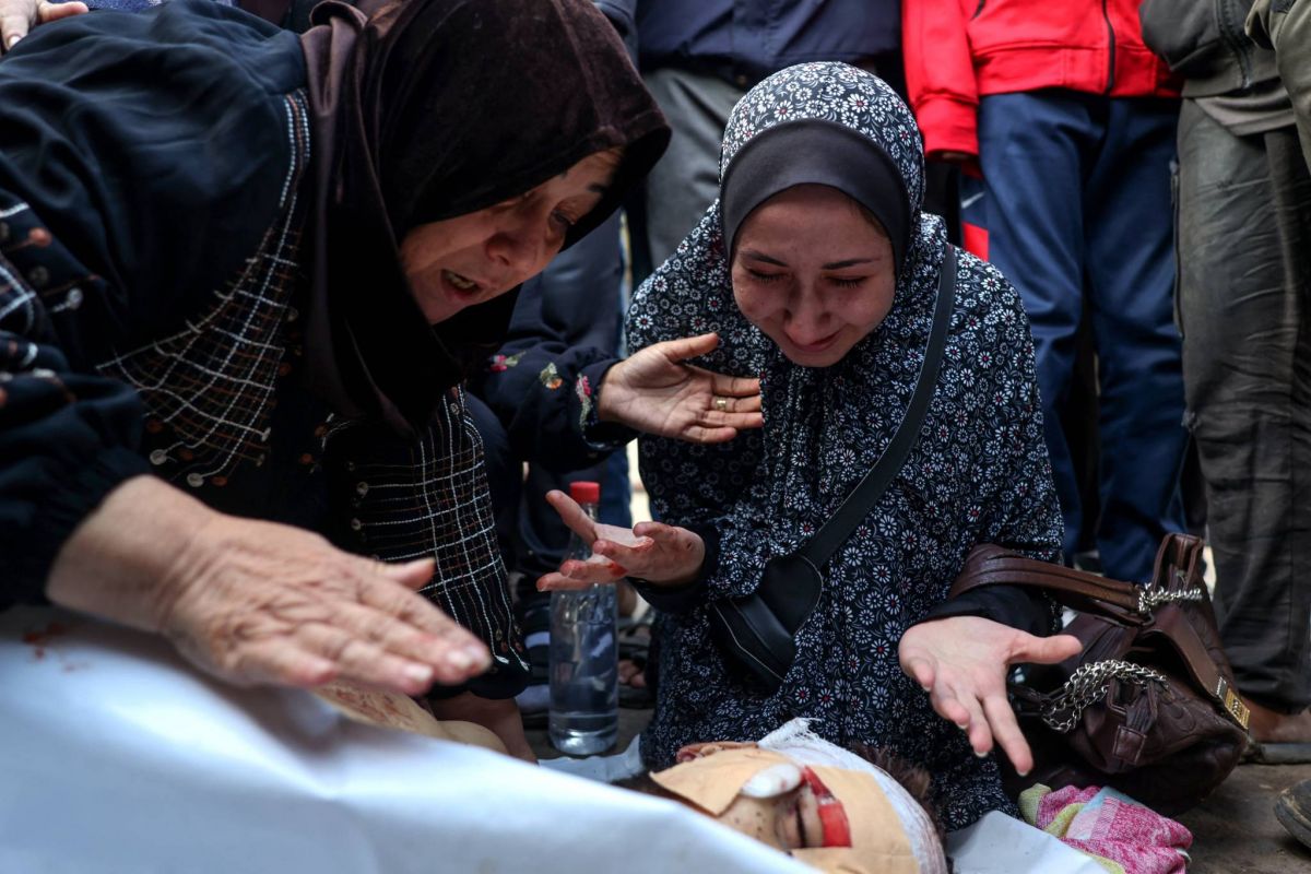 Gaza rescuers say Israeli strikes kill 58, hit flour trucks