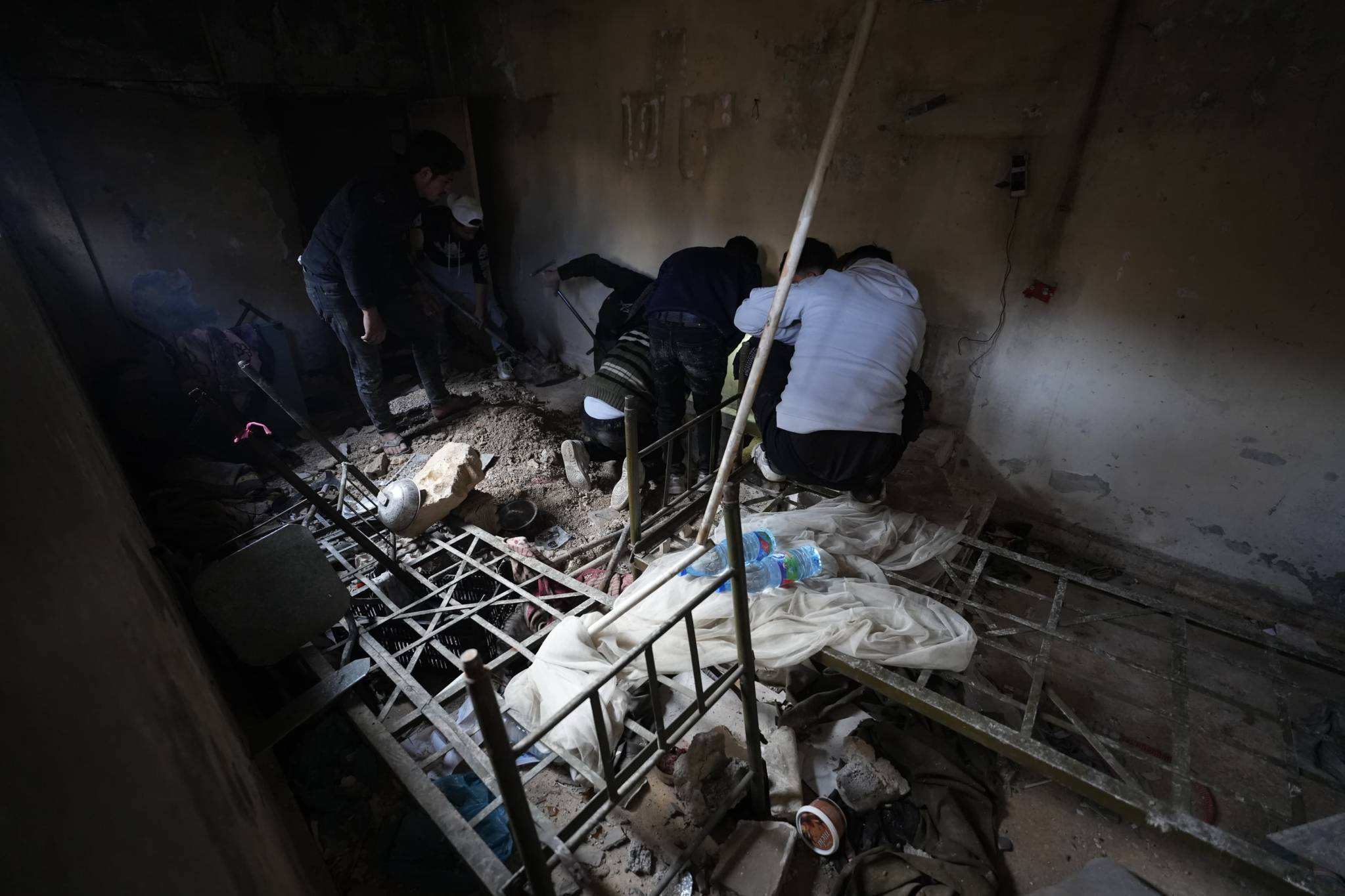 As rumors spread of basement cells, many family members searched everywhere, digging and breaking walls, hoping to find someone. (Photo: Mohammad Yassin)