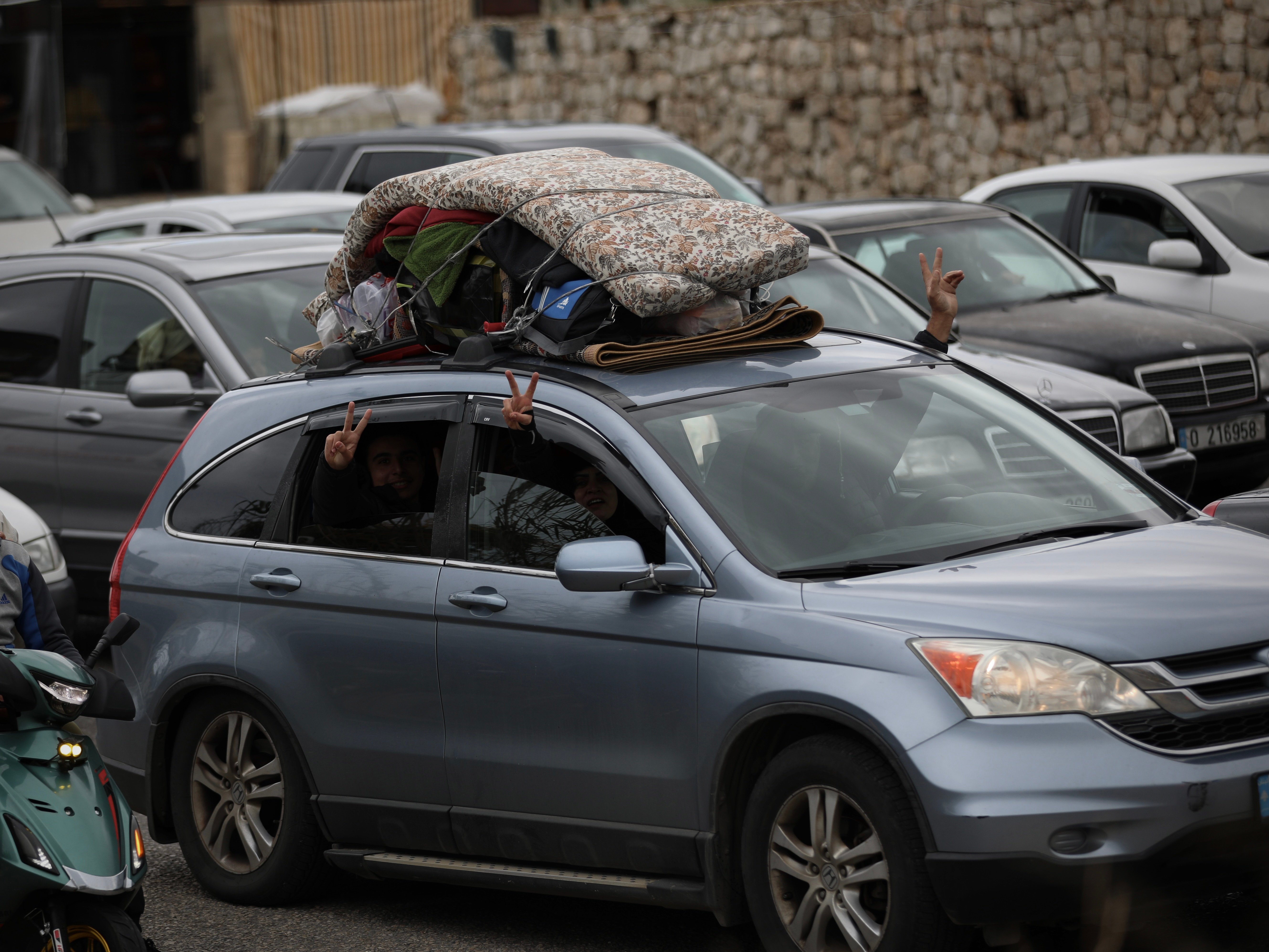 On the highway leading to south Lebanon, dozens of cars are heading toward towns and villages that have become uninhabitable since the intensification of the bombings. On the roofs of the vehicles, mattresses and a few belongings. A big smile on the face of some, drawn features on others. (Credit: Matthieu Karam)