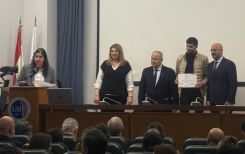 Dean Marie-Claude Najm, USJ Rector Salim Daccache, and Minister Nasser Yassin presenting a certificate to one of the participants in the Youth4Governance program on Thursday at the Faculty of Law at USJ. (Credit: Suzanne Baaklini/L’Orient-Le Jour)