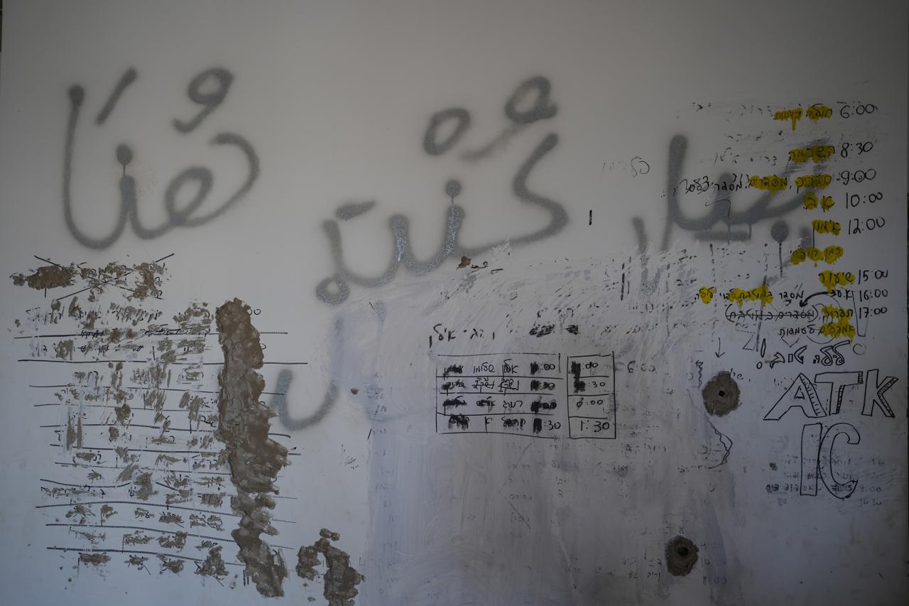 This report details the movements of Israeli soldiers, including the opening and closing of an unidentified gate, along with other activities in the region. A message in Arabic is also scribbled "I was here." (Credit: Mohammad Yassin/L'Orient Le-Jour)