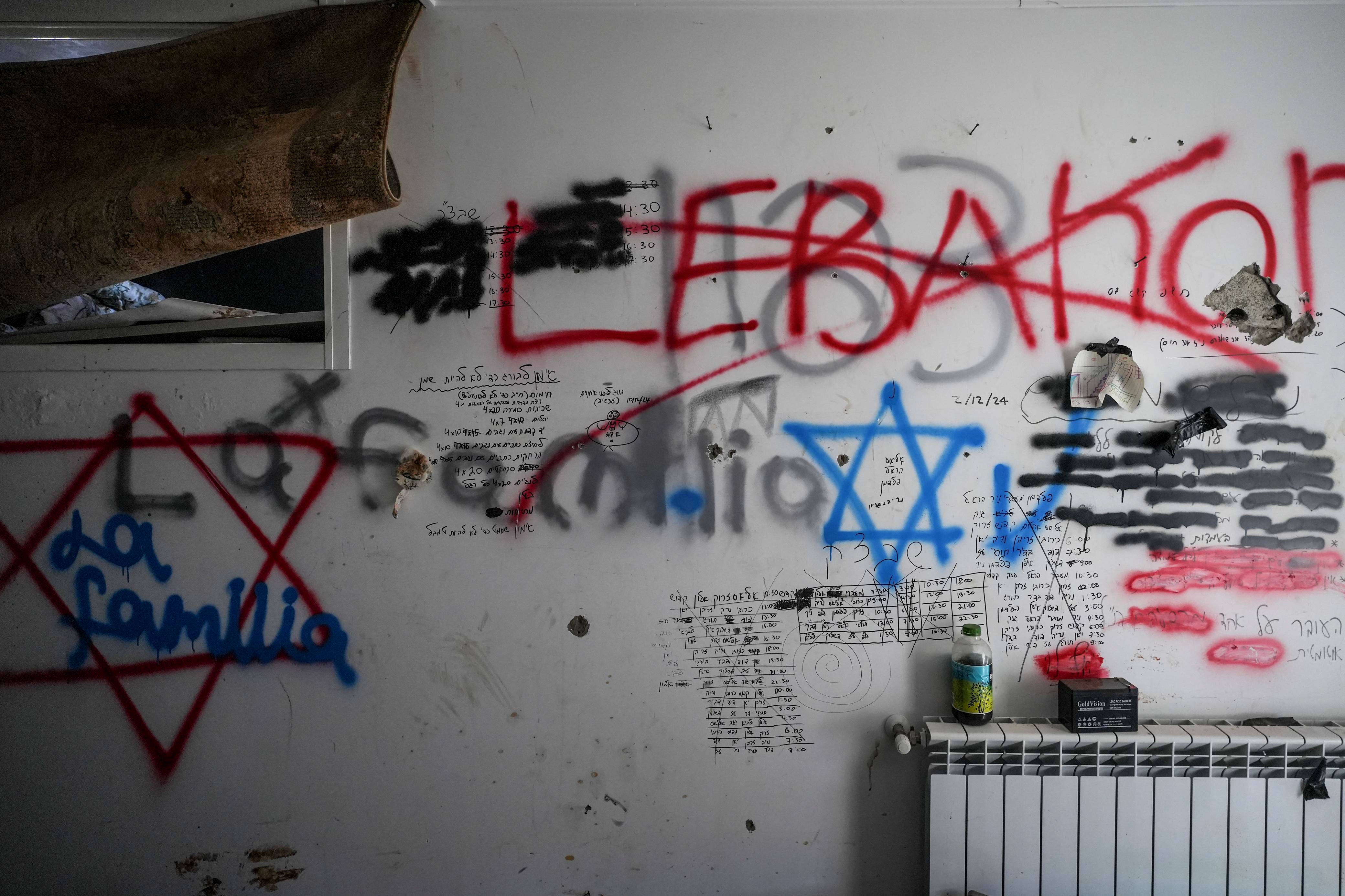 In the few still standing in Khiam, Israeli soldiers vandalized houses leaving menacing graffiti behind. Here, the word "Lebanon" is crossed out and surrounded by the Stars of David. (Credit: Mohammad Yassin/L'Orient Le-Jour)