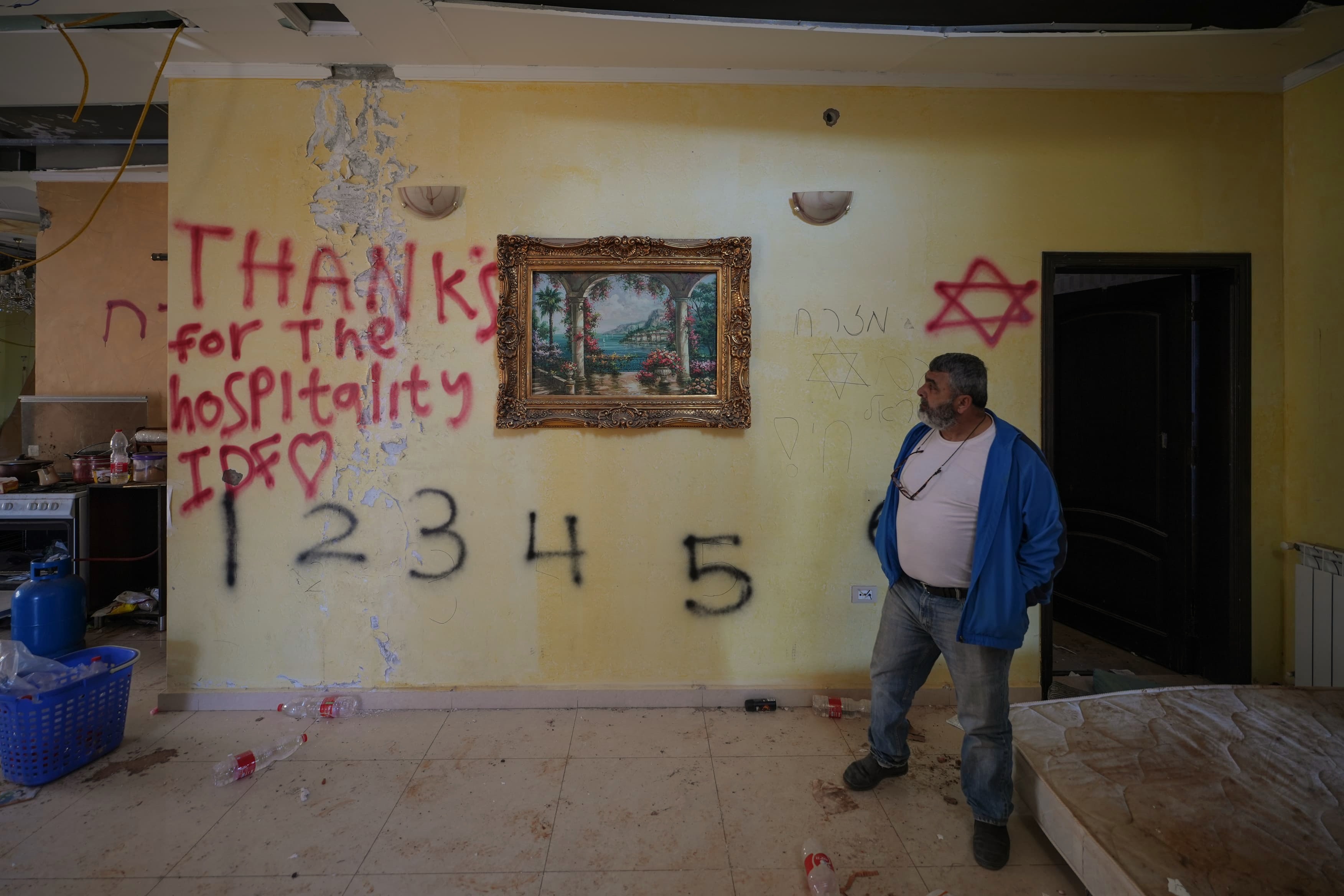 In another villa in Khiam, Israeli soldiers left numerous vandalizing graffiti before leaving — including this seemingly satirical dark message: "Thank you for the hospitality." Signed: the Israeli army. (Credit: Mohammad Yassin/L'Oreint Le-Jour)