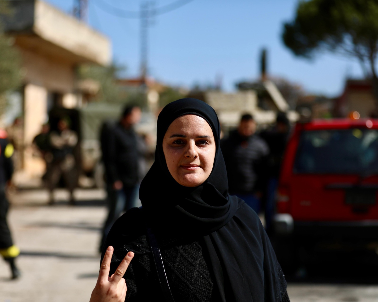 “I come here almost every day, but today is special. You don't see the Israeli enemy anymore,” said Wafaa Hussein, who took shelter during the war in Saida. The thirty-something mourns the memory of a child who was killed by Israeli strikes. “She had courage. We have a lot of martyrs, almost a hundred, and that's something to be proud of... We have a saying in Houla: 'You plant martyrs before you plant olive trees.'" (Credit: Matthieu Karam/OLJ)