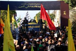 People gather around the coffin of Hashem Safieddine before his burial in Deir Qanoun al-Nahr, south Lebanon, Feb. 24, 2025. (Credit: Thaier Al-Sudani/Reuters)