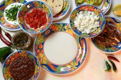 An empty plate of tacos surrounded by your toppings. (Credit: Jad Abou Jaoude/L'Orient Today)