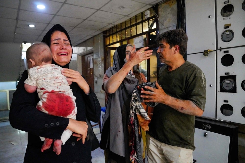 Under bombs in Tehran, Iranians trapped between the regime and Israel