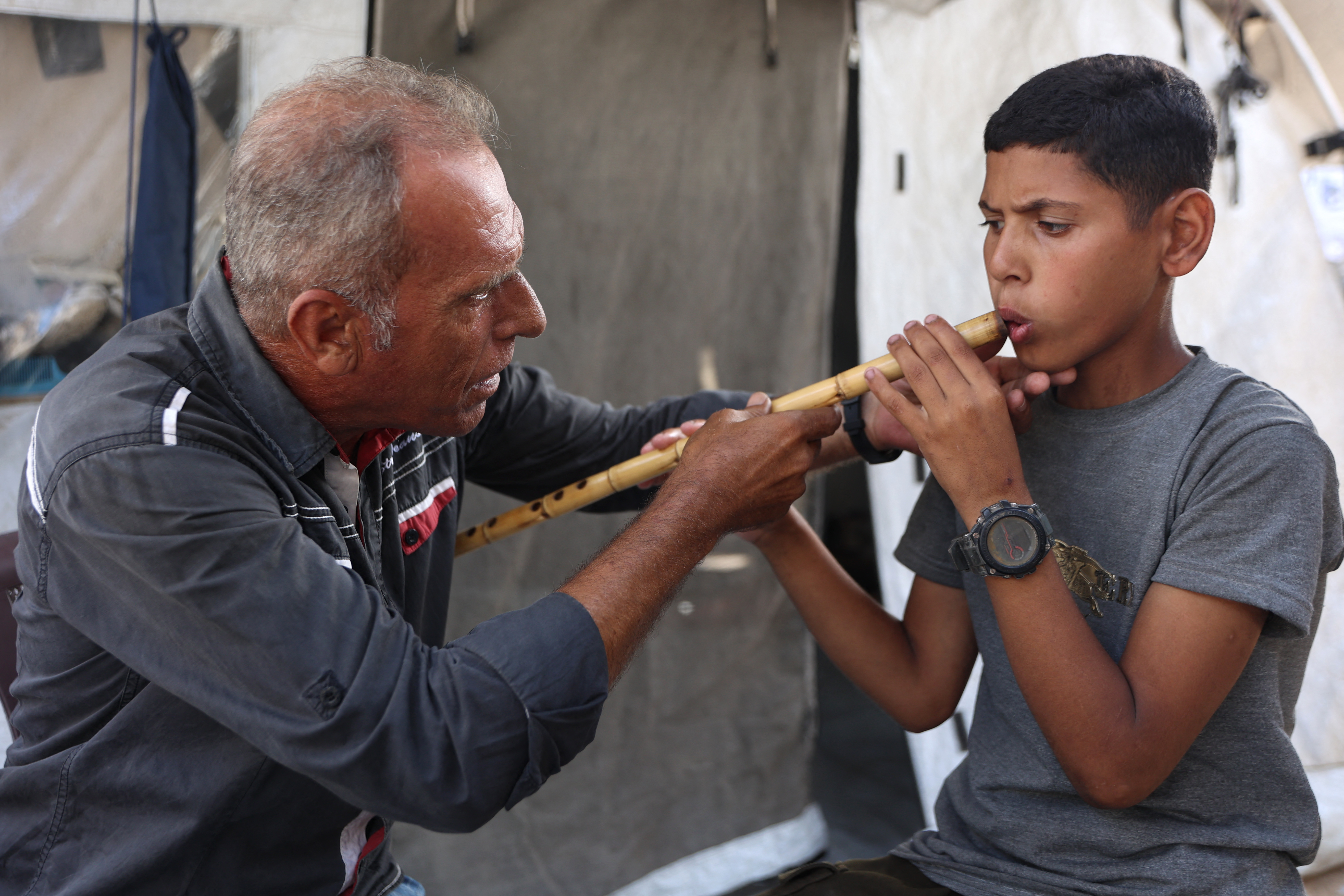 Still, music will always find a way, and so Gaza's musicians put their instruments in their children's hands and are teaching them how to make their own sounds. The relief from war, however brief, is desperately needed. In late May, UNICEF's regional director said that Israel had killed or injured more than 50,000 children in Gaza since October 2023. (Credit: Omar al-Qattaa/AFP)