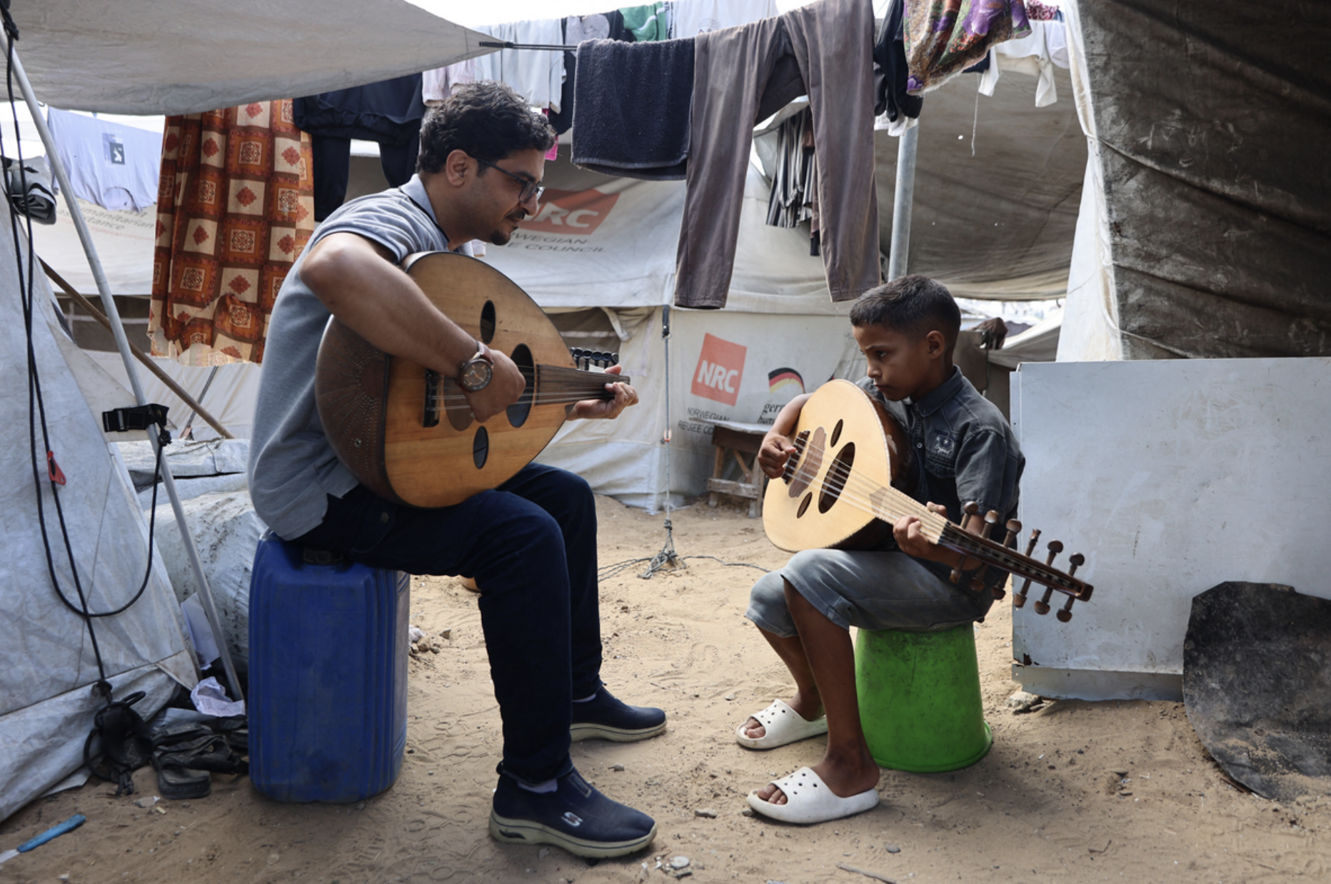 "Music revives the hope that there is still life, that there is a future," Jaber said. "When I see them singing, I feel they are in another world." (Credit: Omar al-Qattaa/AFP)