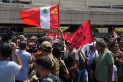 Supporters gathered at Beirut airport for the arrival of Georges Abdallah, waving a flag of the Lebanese Communist Party. (Credit: Mohammad Yassin/L'Orient Today)