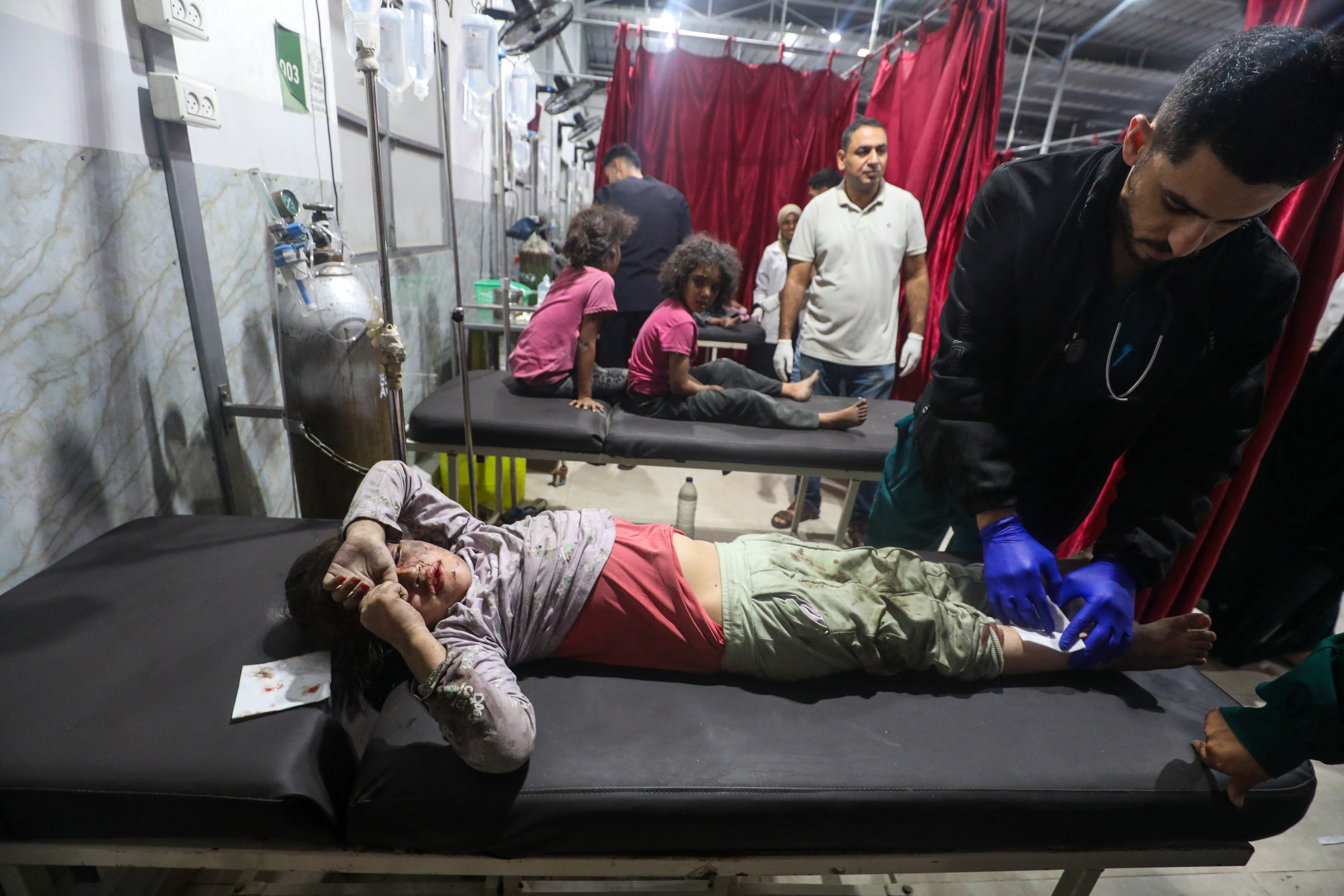 Doctors treat children injured in an Israeli strike at al-Awda Hospital in Nusseirat, central Gaza Strip, Oct. 29, 2025. (Credit: AFP)