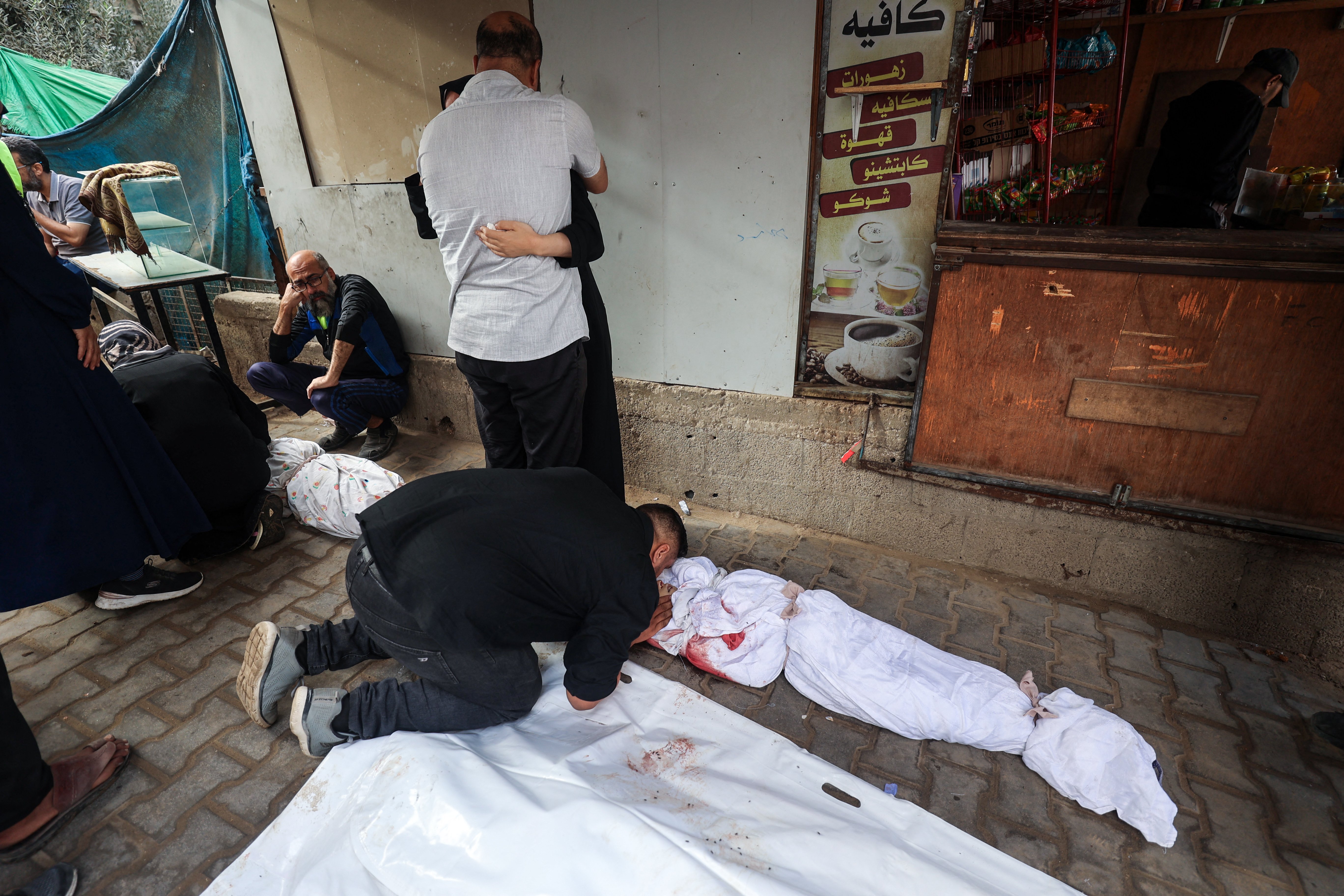 A family mourns their children killed in an Israeli strike, Oct. 29, 2025. (Credit: Eyad Baba/AFP)